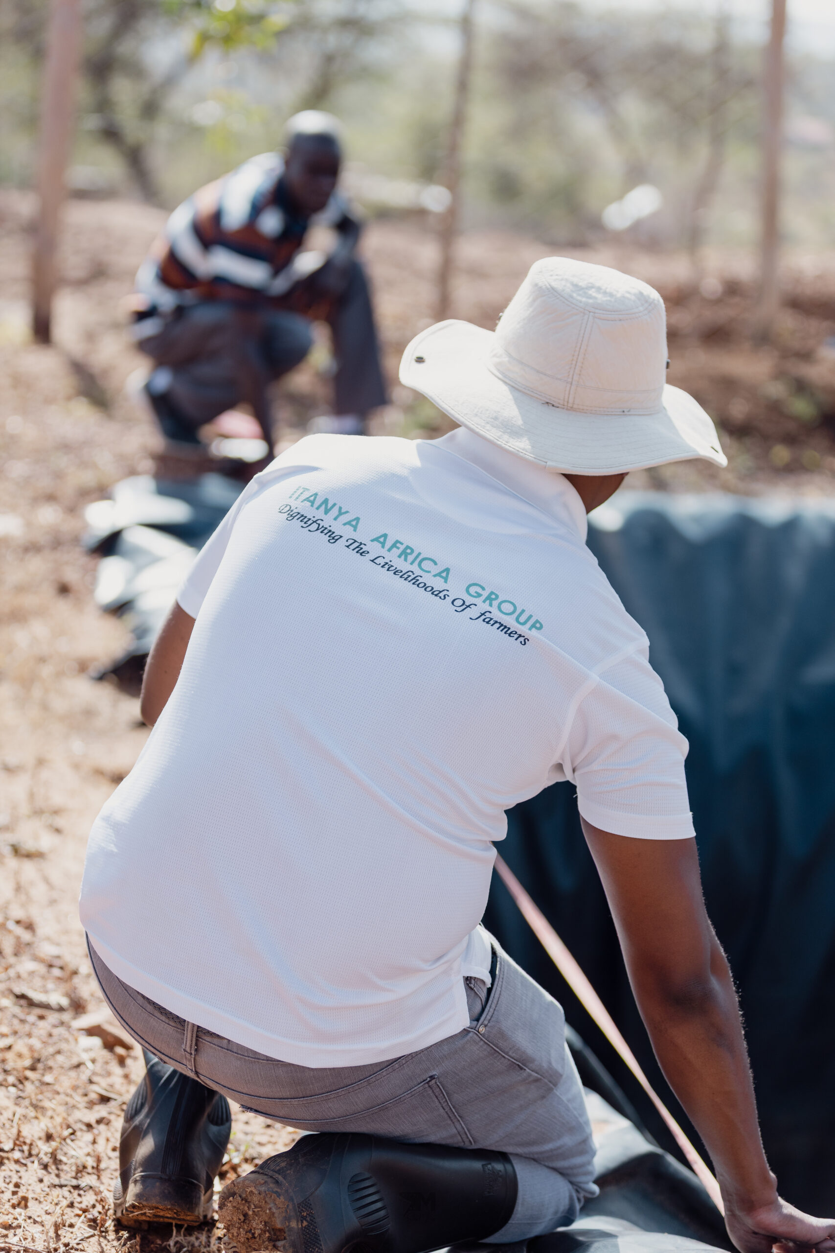 IAG co-founder Samuel Vaita (in a white polo shirt) measuring the size of a water pan together with our water pan expert.