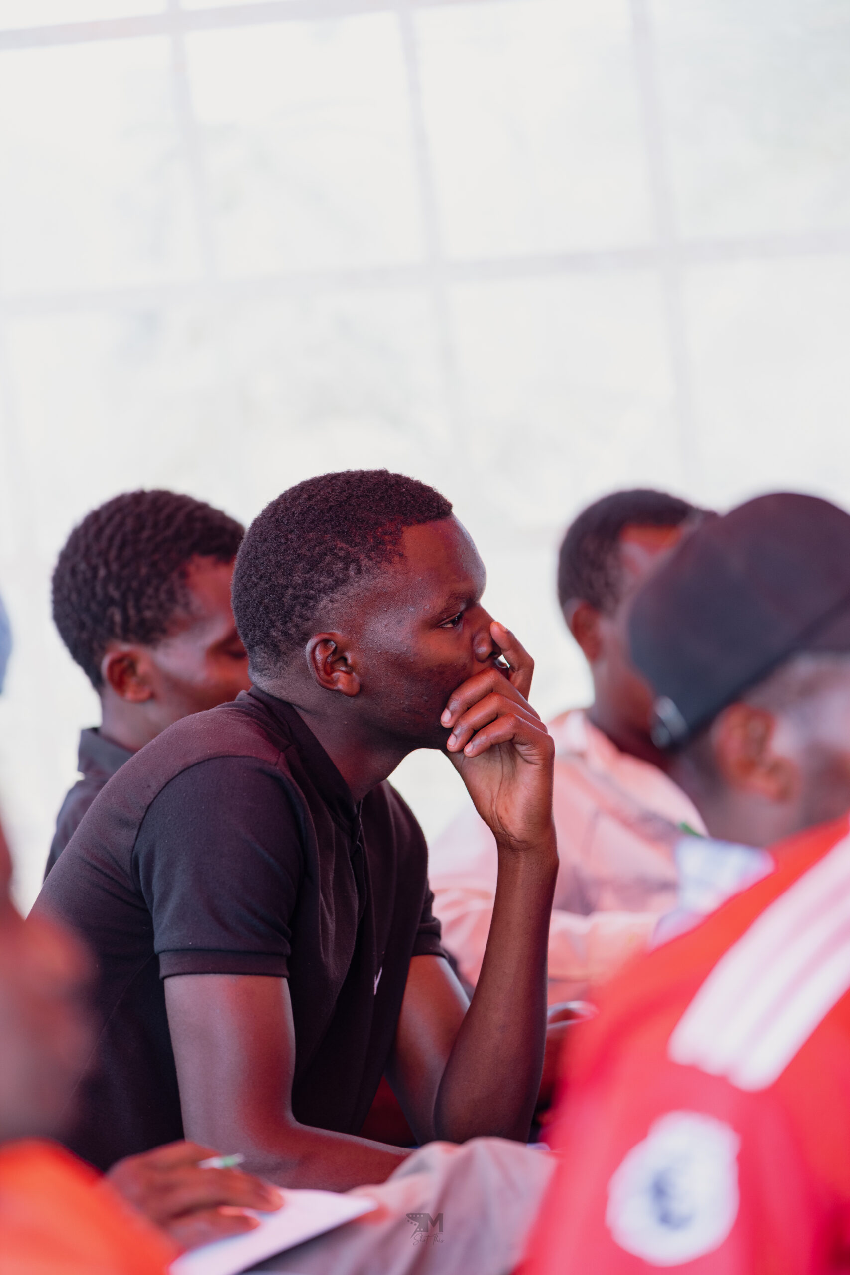 Young men from the community who attended a training by IAG on water pan construction.